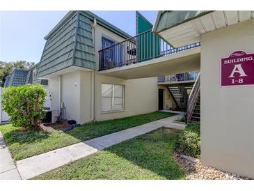 Exterior view of building A, showing walkway and staircase access at 1799 N Highland Ave # 7, Clearwater, FL 33755