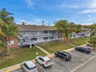 Aerial view of a renovated apartment building with ample parking at 2353 Shelley St # 16, Clearwater, FL 33765