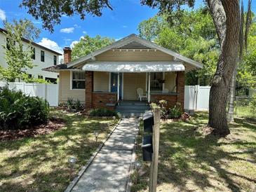 Charming bungalow with a brick facade and landscaped yard at 1435 29Th N Ave, St Petersburg, FL 33704