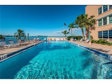 Inviting community pool with waterfront views at 7625 Sun Island S Dr # 103, South Pasadena, FL 33707