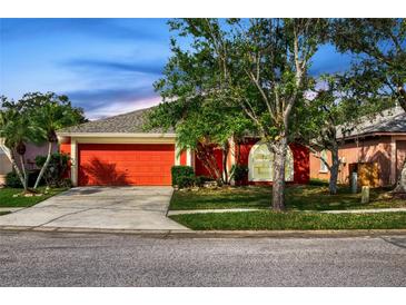 Charming single-story home with a well-maintained lawn and a two-car garage in a desirable location at 27542 Sky Lake Circle, Wesley Chapel, FL 33544