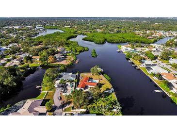 Bird's-eye view of waterfront house and neighborhood at 853 Seacrest Dr, Largo, FL 33771