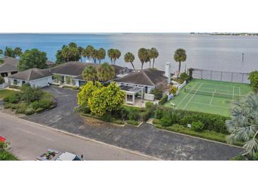 Luxury waterfront home with private tennis court at 5031 W San Miguel St, Tampa, FL 33629