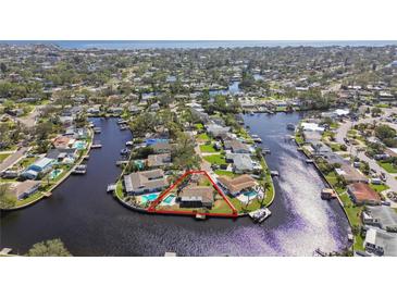 Aerial view of waterfront home with private dock and pool at 5181 Horseshoe Ne Pl, St Petersburg, FL 33703