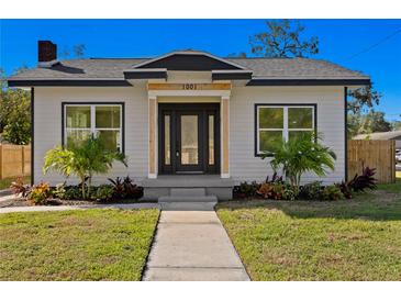 Charming craftsman style home with a well-manicured lawn at 1001 E New Orleans Ave, Tampa, FL 33603