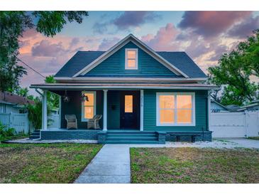 Charming home with a covered front porch, perfect for relaxing outdoors at 3506 N Arlington Ave, Tampa, FL 33603