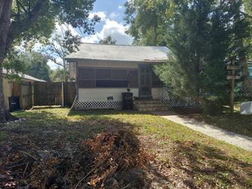 Quaint house exterior with a screened porch at 5748 Montana Ave, New Port Richey, FL 34652