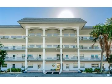 Three-story building with balconies and covered entryway at 3018 59Th S St # 209, Gulfport, FL 33707