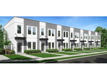 Modern townhome community with gray and white exteriors, landscaping, and walkways at 3402 E 28 Ave # 1, Tampa, FL 33605