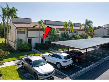 Condo complex with carport parking and tennis courts nearby at 9209 Seminole Blvd # 75, Seminole, FL 33772