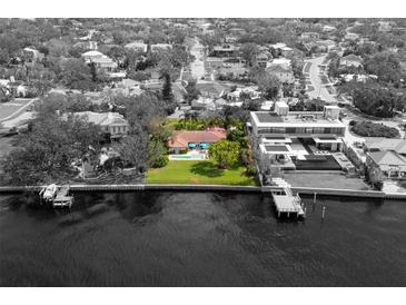 Property overview showing house, pool, and waterfront location at 306 Blanca Ln, Tampa, FL 33606