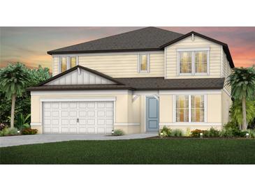 Charming two-story home with a two-car garage, light yellow siding, and a well-manicured lawn at 4206 Feldspar Ln, Spring Hill, FL 34609