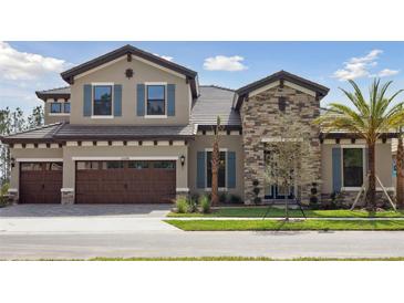 Charming two-story home featuring a stone facade, blue shutters, and a well-manicured front yard at 35298 Big Hawk Dr, Zephyrhills, FL 33541
