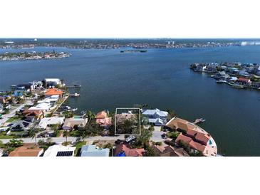 Aerial view showing a house on a quiet residential street at 6351 4Th Palm Pt, St Pete Beach, FL 33706