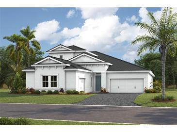 Two story home with a modern exterior and a two car garage at 17535 Glistening Ct, Venice, FL 34293