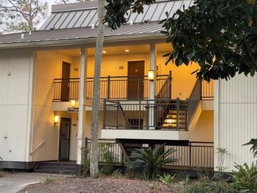 Two-story building with exterior lighting at 29254 Bay Hollow Dr # 3262, Wesley Chapel, FL 33543