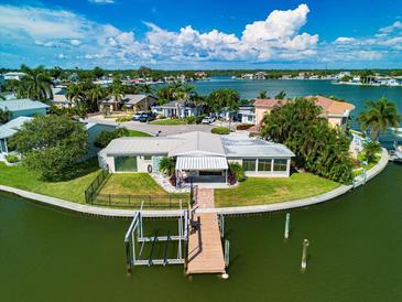 Waterfront home with private dock and lush landscaping at 17444 2Nd E St, Redington Shores, FL 33708