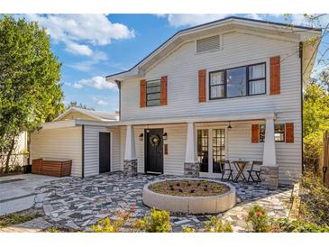 Two-story home with inviting front porch and landscaping at 206 W Frierson Ave, Tampa, FL 33603