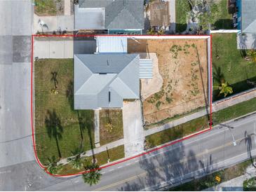 Aerial view of a single Gathering home and surrounding lot at 7951 Gulf Blvd, St Pete Beach, FL 33706