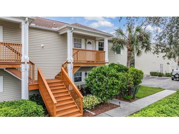 Two story condo building with private balcony and stairs at 9016 Shallowford Ln # 202, Port Richey, FL 34668