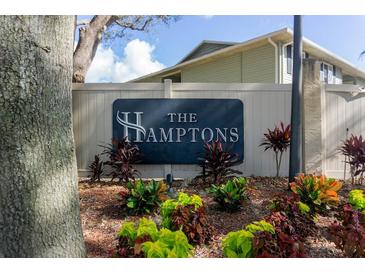 The Hamptons community sign surrounded by colorful landscaping at the entrance at 237 Thorn Tree Pl # 237, Brandon, FL 33510