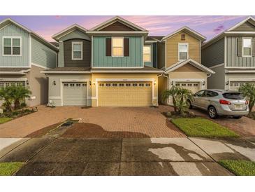 Three-story townhome with two-car garage at 34209 Rogallo Ln, Wesley Chapel, FL 33545