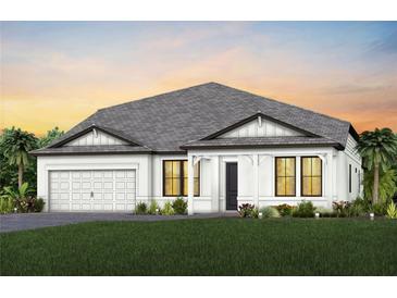 One-story home with gray roof and white exterior at 5732 Silverside Pine Ct, Lakewood Ranch, FL 34211