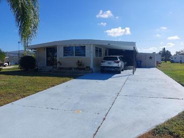 Mobile home with carport at 164 Colonial Ct # 19, Palm Harbor, FL 34684