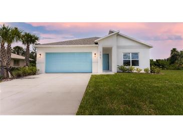 Modern single story home with light blue garage door at 285 Porto Alegre St, Punta Gorda, FL 33983