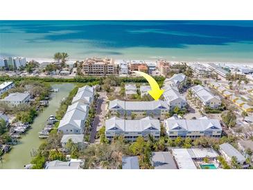 Aerial view of the property near the water at 94 The Cove Way, Indian Rocks Beach, FL 33785