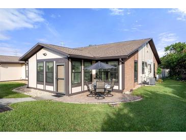 Charming patio with seating area, perfect for outdoor dining at 37820 Alissa Dr, Zephyrhills, FL 33542