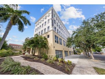 Modern building exterior with palm trees and a walkway at 205 5Th N Ave # 202, St Petersburg, FL 33701