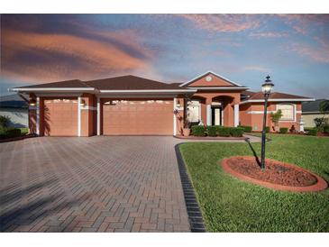 Attractive single-story home with a large driveway and landscaped yard at 5444 90Th Avenue E Cir, Parrish, FL 34219