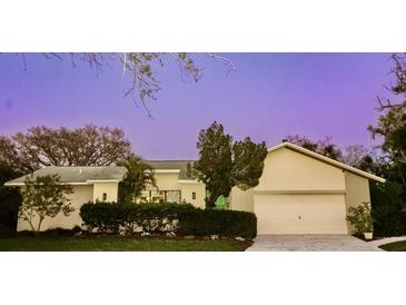 Charming single-story home featuring a well-manicured lawn and an attached two-car garage at 7255 18Th Ne St, St Petersburg, FL 33702