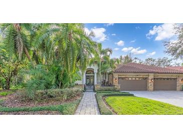Exterior of a beautiful, two-story home with a three-car garage at 4907 Londonderry Dr, Tampa, FL 33647