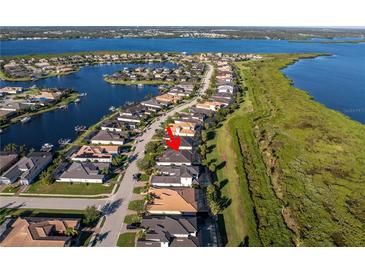 An aerial view of a waterfront home in a residential community at 5608 Tidewater Preserve Blvd, Bradenton, FL 34208