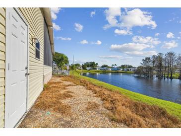 Waterfront view home with a large backyard and access to a canal at 619 Pelican S Dr, Oldsmar, FL 34677