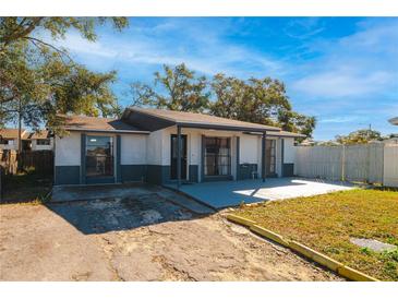 House exterior with a gray and white color scheme at 9102 Post Oak Ct, Tampa, FL 33615