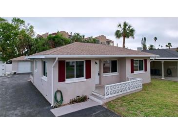 Charming single-story home with a carport and well-maintained lawn at 3505 Casablanca Ave, St Pete Beach, FL 33706