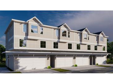 Three-unit townhome building with attached garages at 4208 W Carmen St # B, Tampa, FL 33609