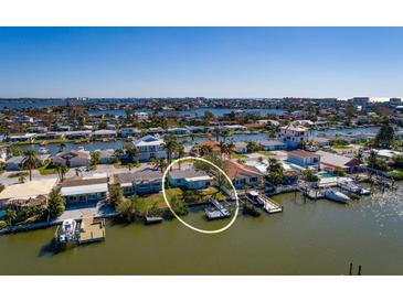 Bird's-eye view of waterfront home with boat dock at 17726 Long Point Dr, Redington Shores, FL 33708