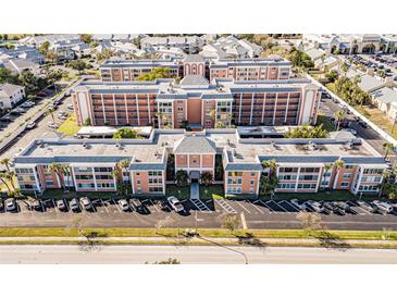 Aerial view of a large apartment building with ample parking at 1900 68Th N St # 301, St Petersburg, FL 33710