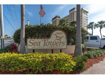 Sea Towers adult community sign with building in background at 4575 Cove Cir # 202, St Petersburg, FL 33708