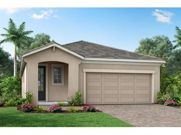 Charming one-story home with two-car garage and landscaped yard at 12248 Meditation Trl, Venice, FL 34293