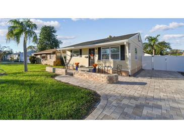 Well-maintained home with a spacious front yard and walkway at 4129 36Th N Ave, St Petersburg, FL 33713