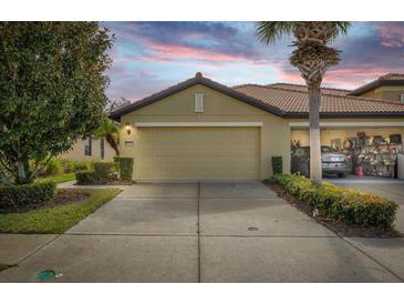 Charming home with two-car garage and landscaped front yard at 5641 Sunset Falls Dr, Apollo Beach, FL 33572