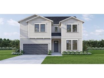 Two-story house with gray siding, dark gray garage door, and landscaping at 446 Rotary Ne Pl, St Petersburg, FL 33703