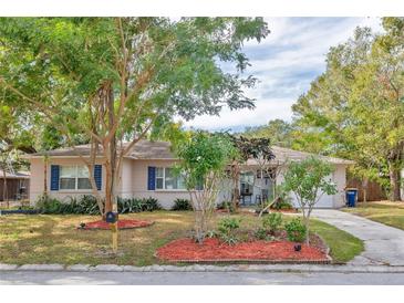 Charming single story home with mature landscaping and a spacious front yard at 1008 Chester Dr, Clearwater, FL 33756