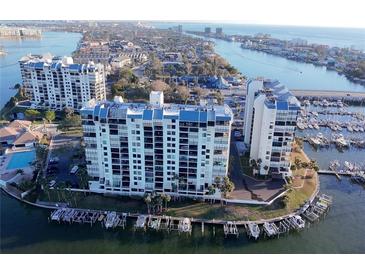 Waterfront condo community with marina access offering scenic views and convenient parking at 9415 Blind Pass Rd # 905, St Pete Beach, FL 33706