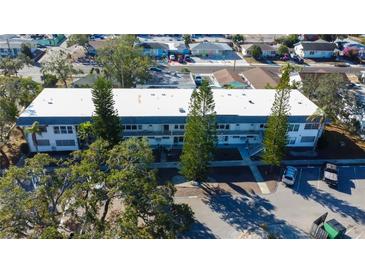 Aerial view of a multi-unit residential building with ample parking at 1221 Drew St # E11, Clearwater, FL 33755